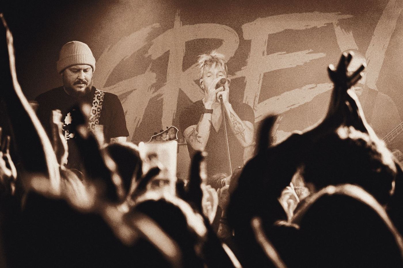 Grey Daze on stage in front of the band banner