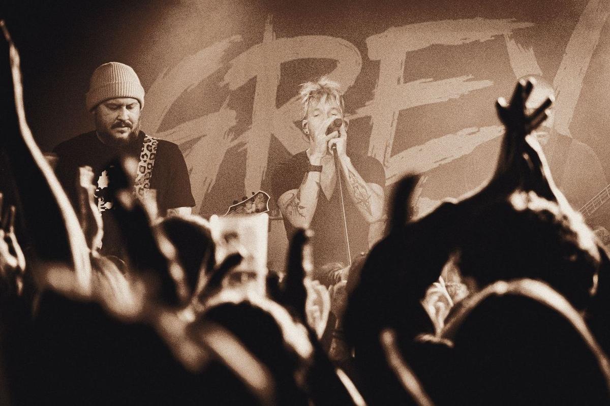 Grey Daze on stage in front of the band banner